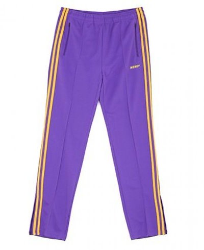 purple and yellow track pants