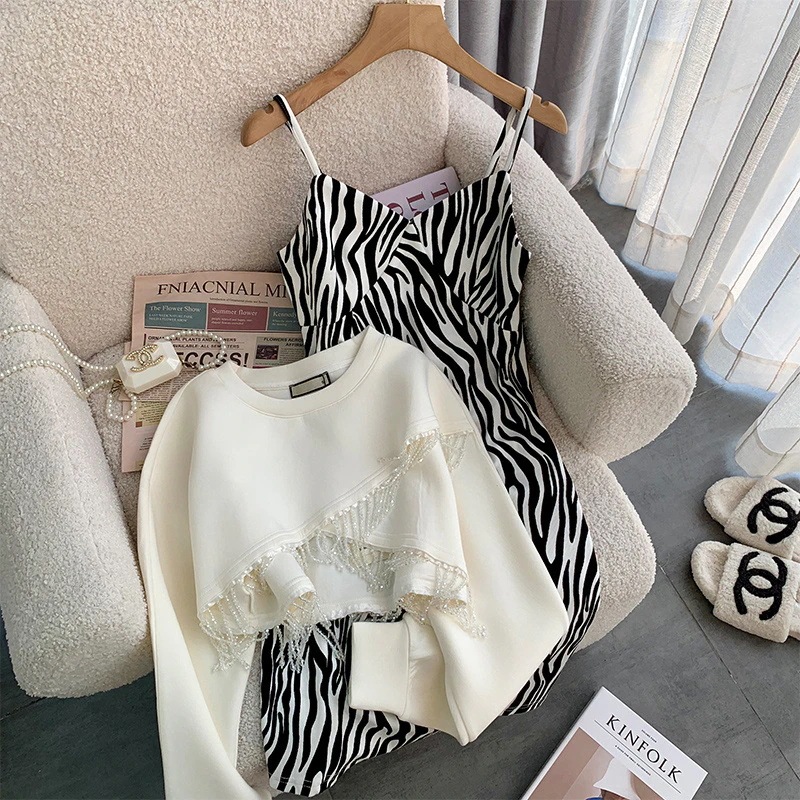 ハイエンドのカスタマイズ-ファッショナブルなスウェットシャツスカートスーツ 2024 春の新作ゼブラ柄甘辛ヒップドレスタッセル長袖トップトレンディ