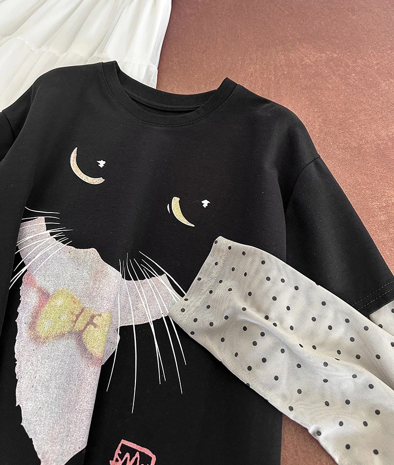 春の新型韓国フェイクレイヤード可愛い猫の丸首のゆったりとした小衆の長袖のプリントtシャツです 春の新型韓国フェイクレイヤード可愛い猫の丸首のゆったりとした小衆の長袖のプリントtシャツです
