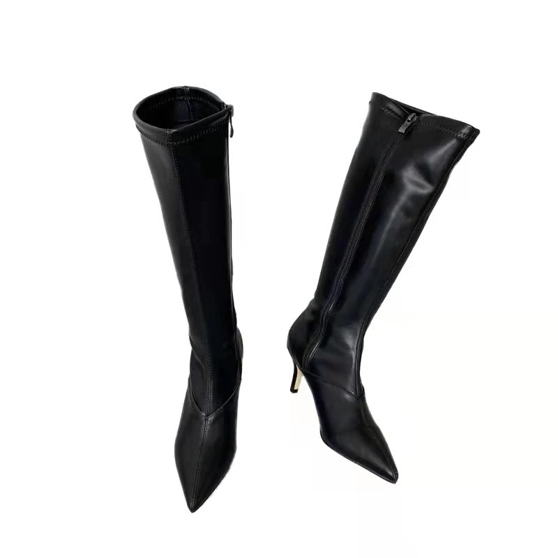 はらはらとした白い長靴の女性の新型ハイヒールがやせているブーツの騎士靴の先が膝を越えて冬になる はらはらとした白い長靴の女性の新型ハイヒールがやせているブーツの騎士靴の先が膝を越えて冬になる