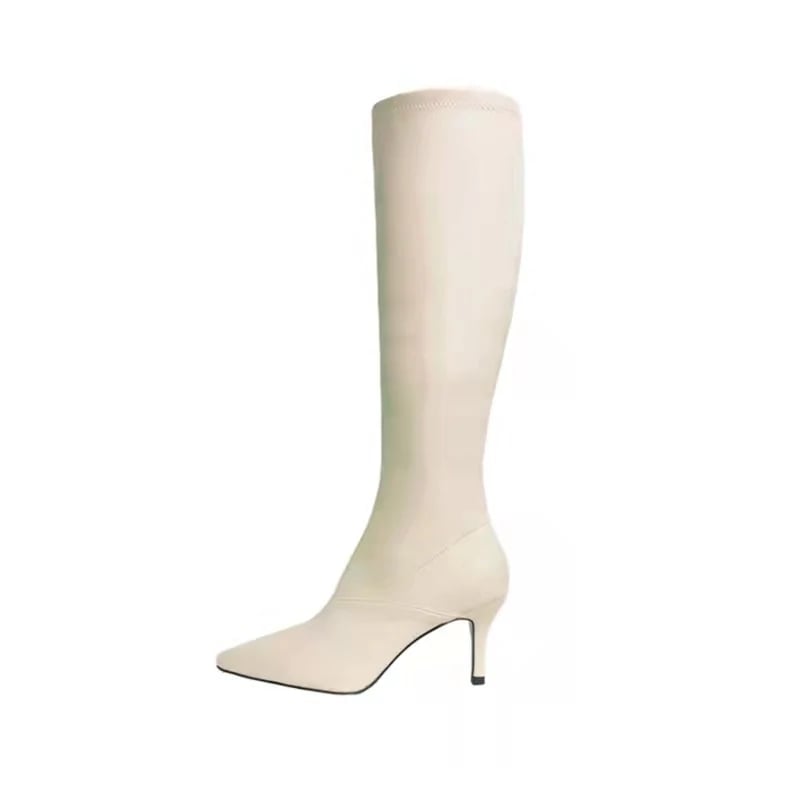 はらはらとした白い長靴の女性の新型ハイヒールがやせているブーツの騎士靴の先が膝を越えて冬になる はらはらとした白い長靴の女性の新型ハイヒールがやせているブーツの騎士靴の先が膝を越えて冬になる