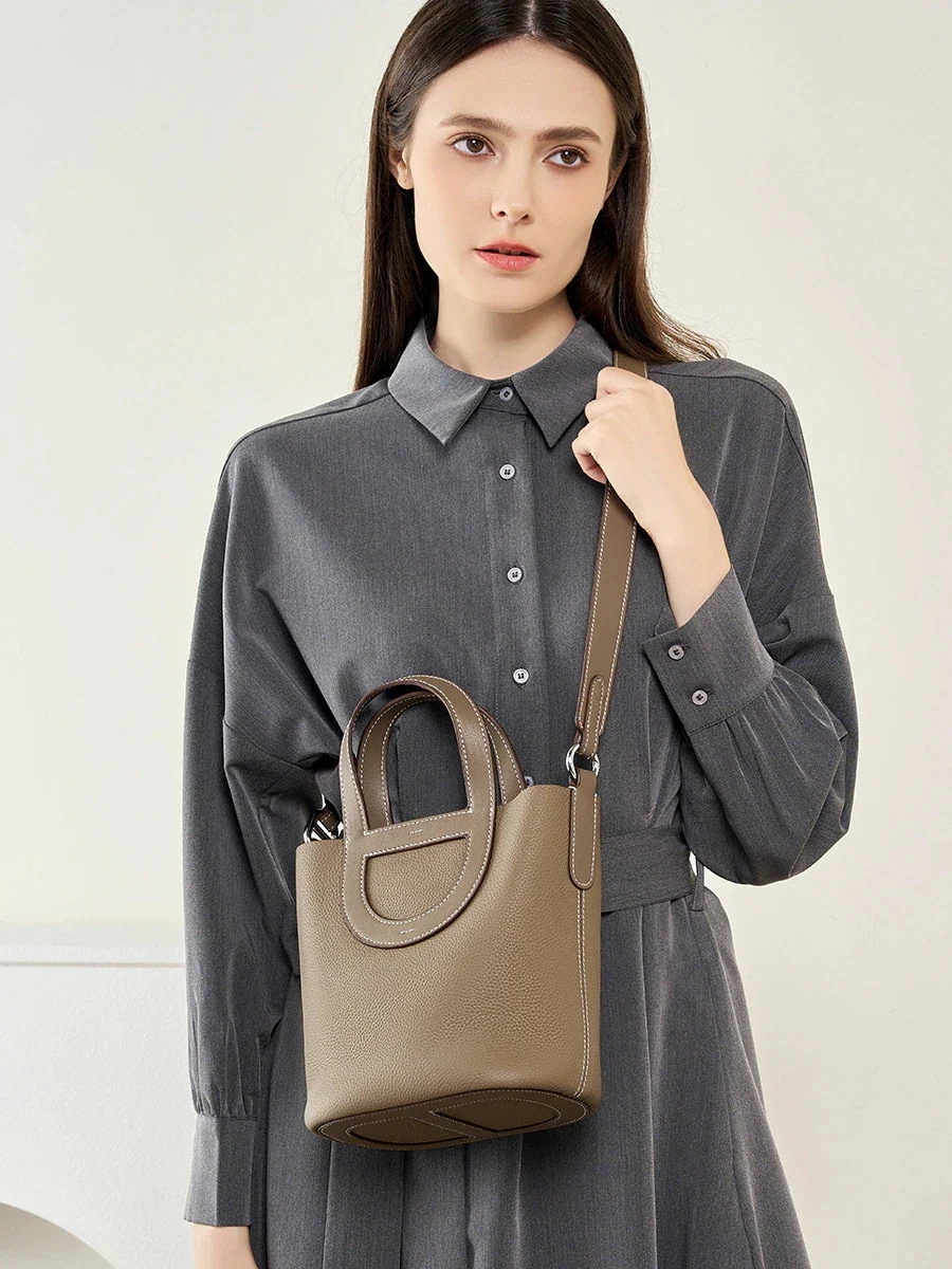 バケットバッグ 斜め掛け 豚鼻クロスボディハンドバッグ レディースファッション牛革バッグ 【1つ買うと10つ無料】ショルダーバッグ 大容量