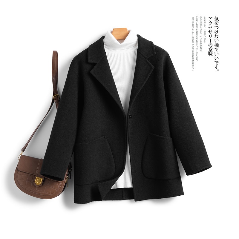 一粒のウールのラシャのコートは秋冬の保温が純粋で街頭のゆったりとしたファッションがあります