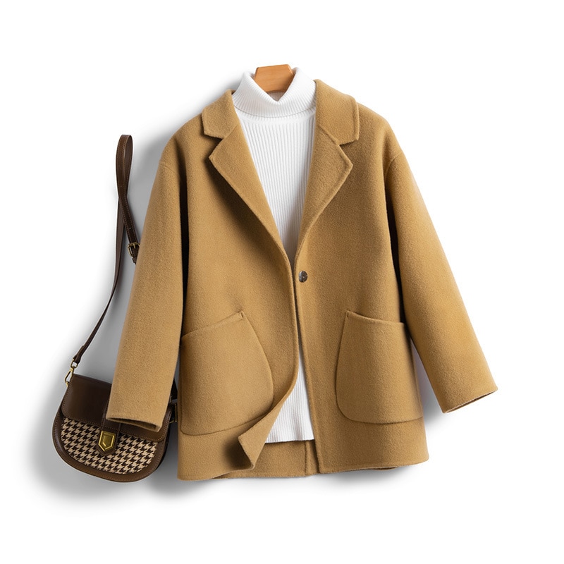 一粒のウールのラシャのコートは秋冬の保温が純粋で街頭のゆったりとしたファッションがあります