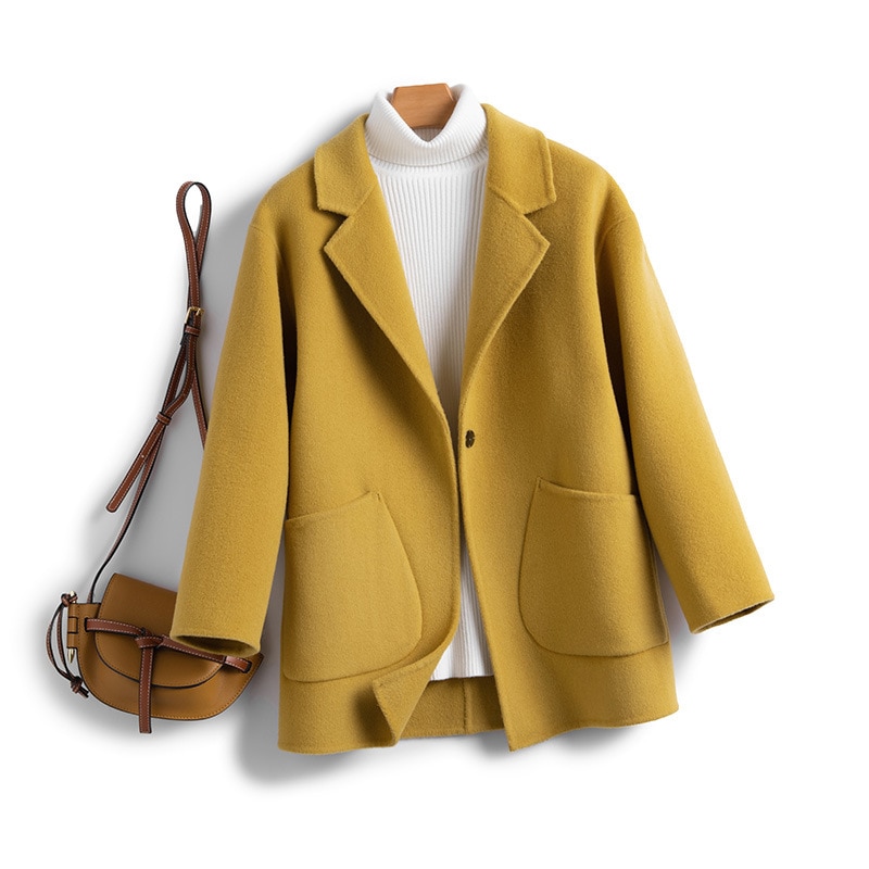 一粒のウールのラシャのコートは秋冬の保温が純粋で街頭のゆったりとしたファッションがあります