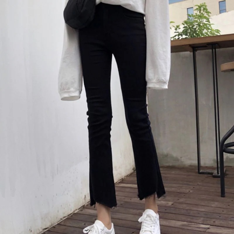 ダメージジーンズ スキニーパンツ ジーンズの女子学生は背が高くて腰がゆったりして痩せているフレアーパンツ ダメージジーンズ スキニーパンツ ジーンズの女子学生は背が高くて腰がゆったりして痩せているフレアーパンツ