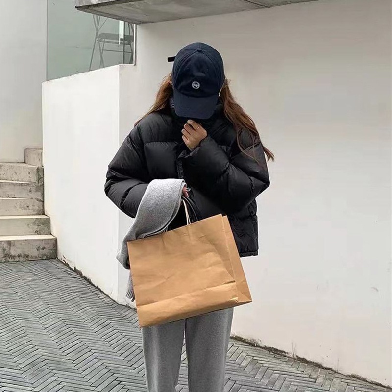 女性のための白いショートダウンジャケット2024新しい韓国スタイルのホワイトダックダウン肥厚スリムスタンドカラー小さな冬コート