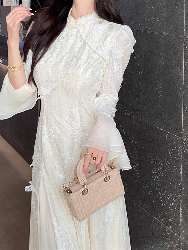 新しい中国のベルベットの刺繍三次元蝶チョンサムドレス女性2025新しいハイエンドの絶妙な国家スタイルのロングスカート