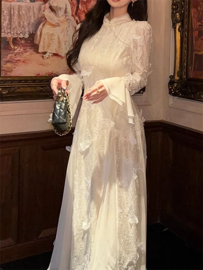 新しい中国のベルベットの刺繍三次元蝶チョンサムドレス女性2025新しいハイエンドの絶妙な国家スタイルのロングスカート