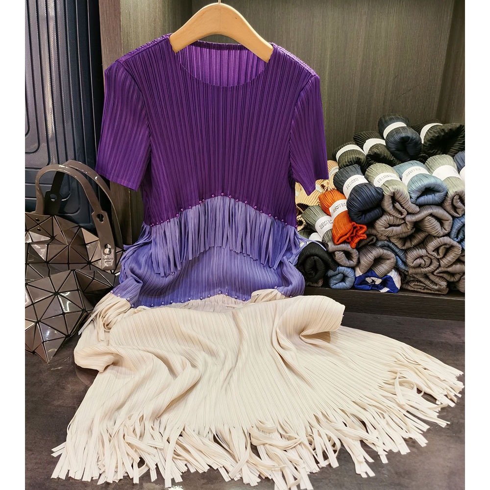 フリンジのしわのワンピースの気質の通勤の丸首の半袖の中で長いスカートの夏