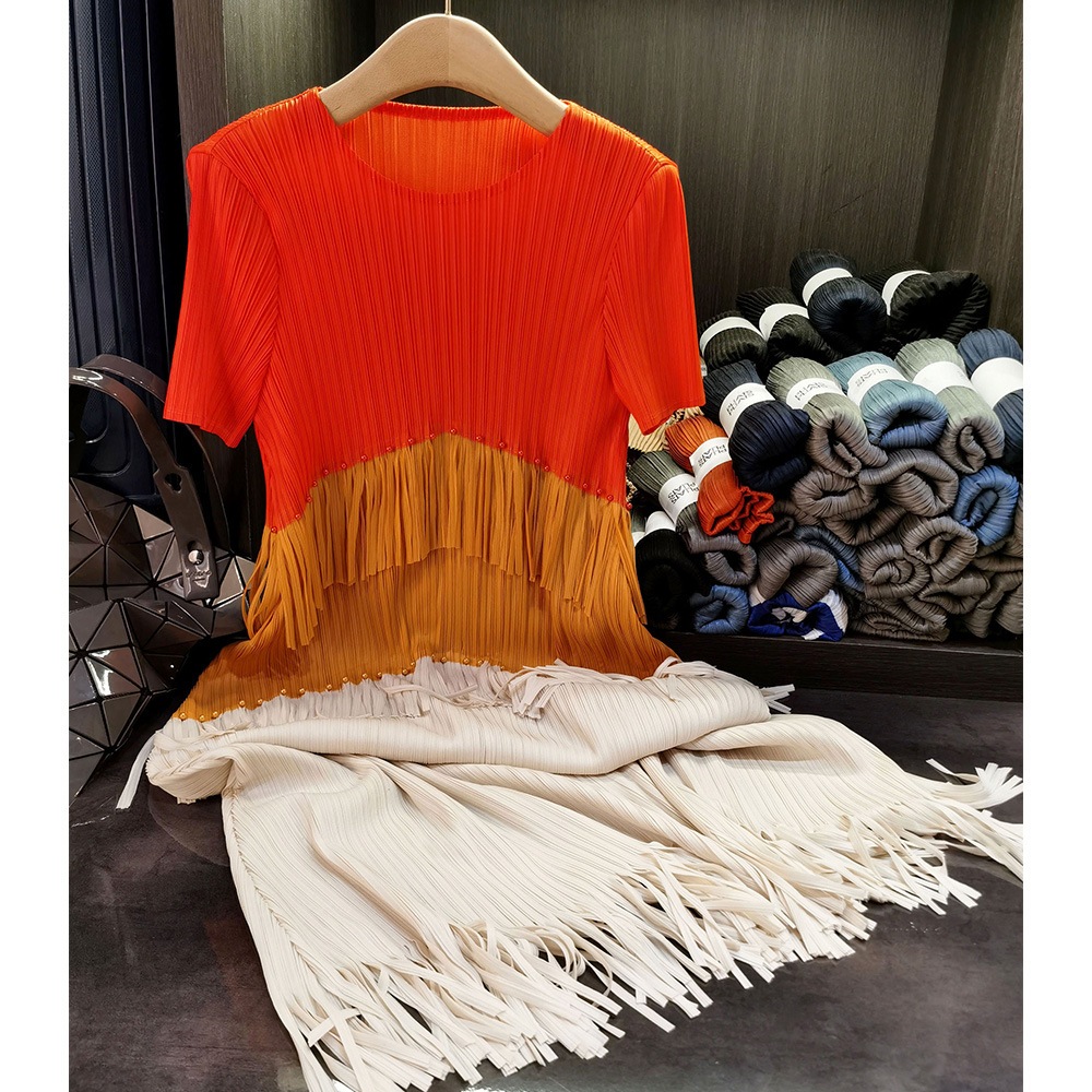 フリンジのしわのワンピースの気質の通勤の丸首の半袖の中で長いスカートの夏