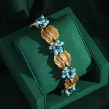 IcareU ヴィンテージチャームビーズブレスレット女性のためのフラワーパール手作りアンティークゴールドカラーリーフ高級品質デザイナー 2025 IcareU ヴィンテージチャームビーズブレスレット女性のためのフラワーパール手作りアンティークゴールドカラーリーフ高級品質デザイナー 2025