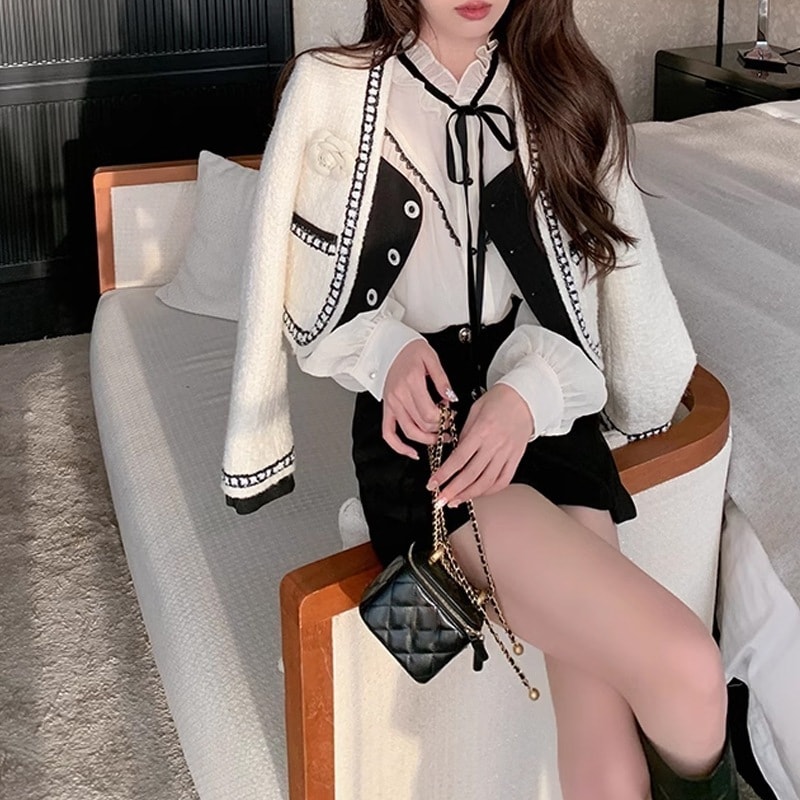 アウターファー毛皮アウターセレブの白黒パッチワーク偽2枚の小さな香風毛ねコート女性のフレンチショート丈トップスブーム