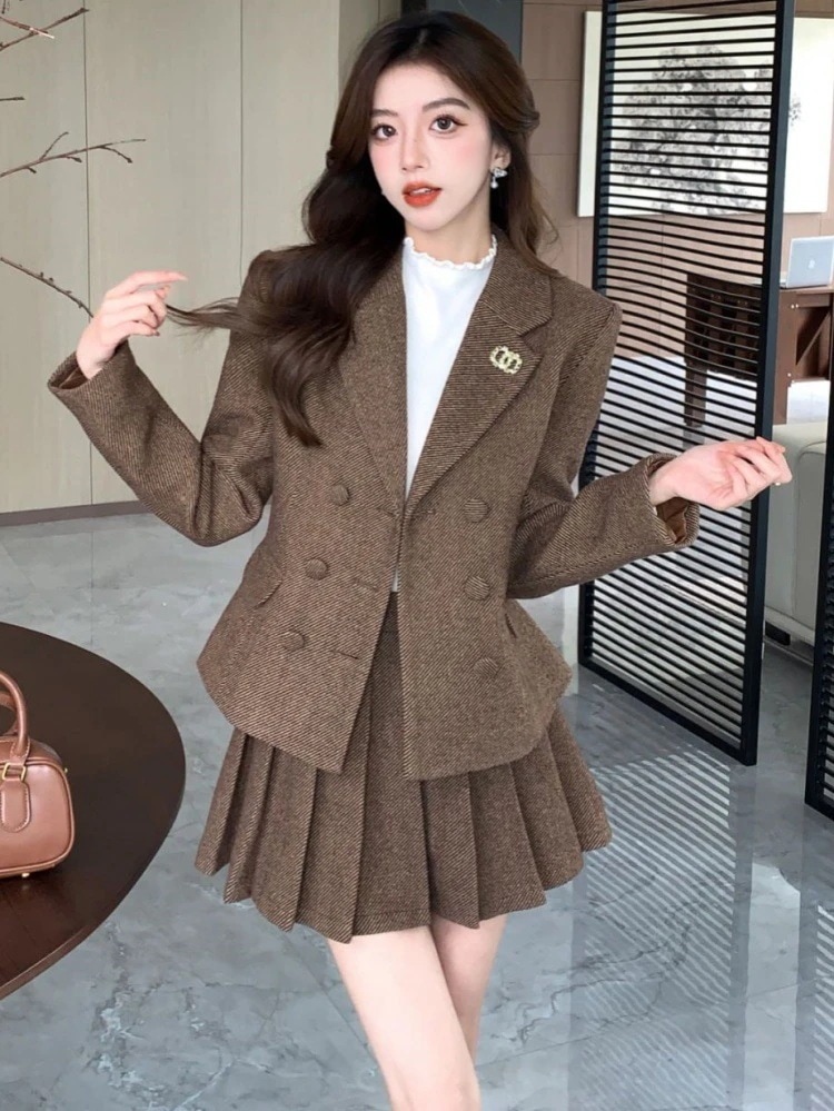 エレガントな気質のスーツスーツ女性秋と冬の厚化粧の綿のジャケットとプリーツの半身のスカートのツーピーススーツ