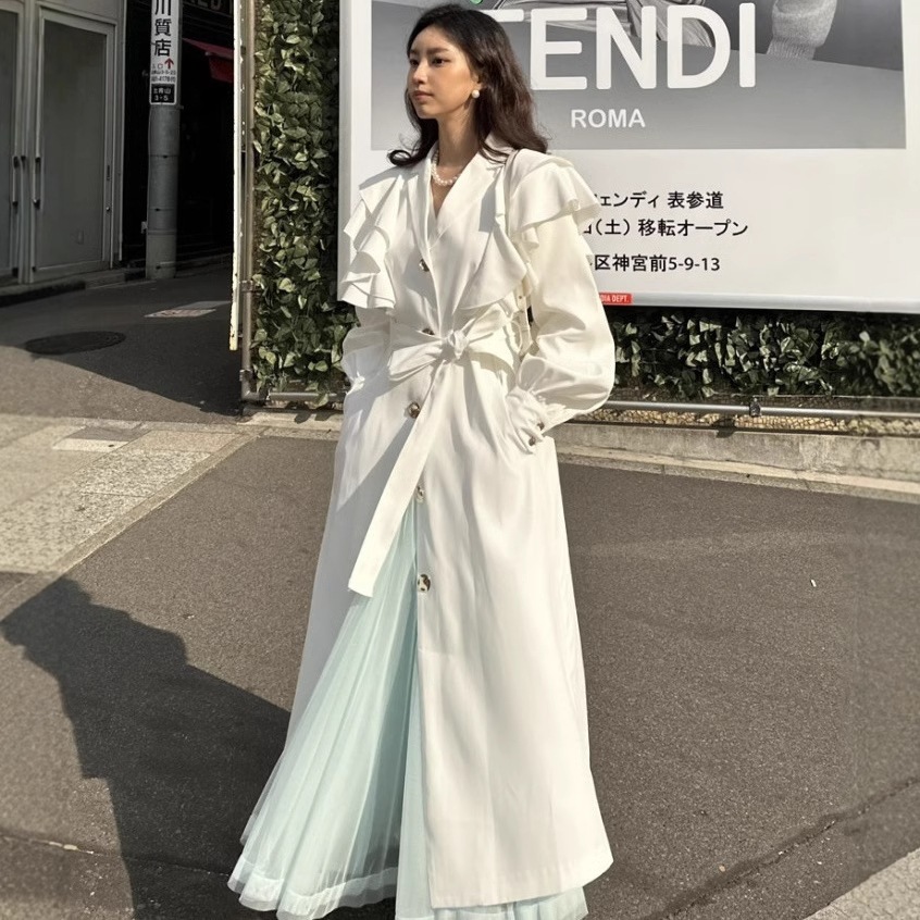 韓国の東大門秋のフランスのレトロな高級気質スーツ襟菌エッジスプライシングロングウインドブレーカージャケット