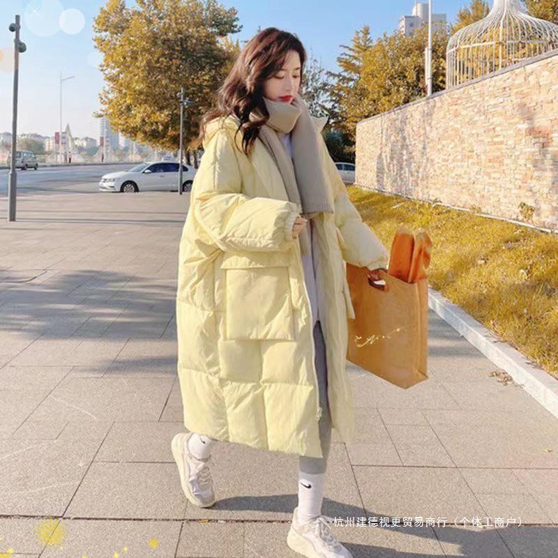 膝上ロングダウンジャケット女性のための冬 2025 新しいファッション小さな肥厚韓国スタイルの綿のコートクリームイエローのコート