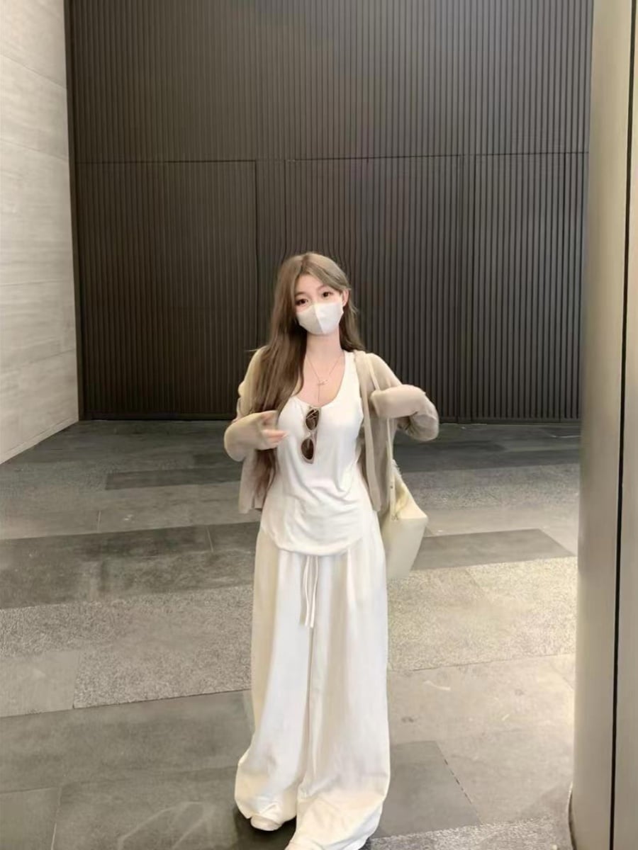 春のカジュアルスーツを着て女性の長袖日焼け止めカーディガン上着を着てタンクトップの高い腰のワイドズボンの3点セットです 5,704円