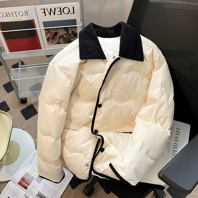 綿のジャケットの緩いカジュアルな綿のジャケットのファッションの学生の綿のジャケットのカップルのモデルのジャケット