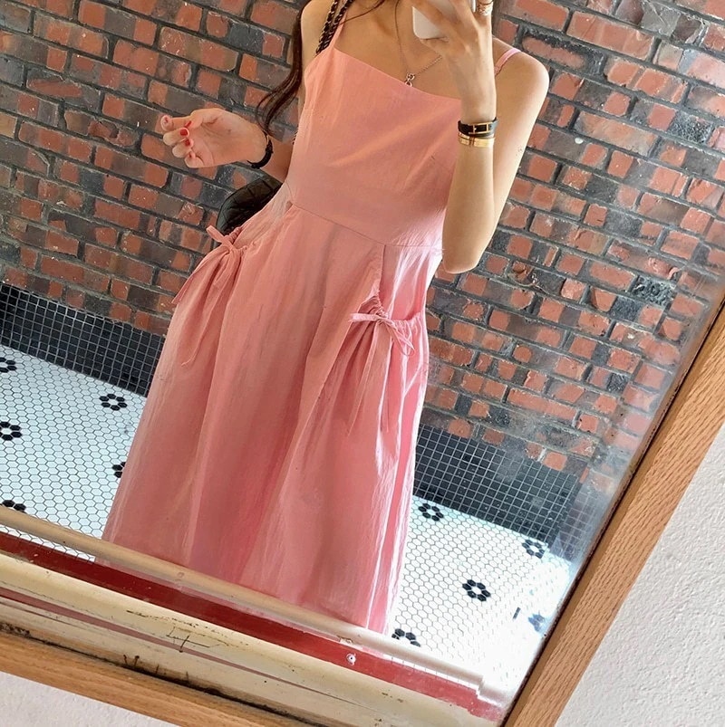 キャミワンピース韓国シック夏新作ニッチデザインビッグポケット蝶ネクタイサスペンダービッグワンピースロングドレス女性用