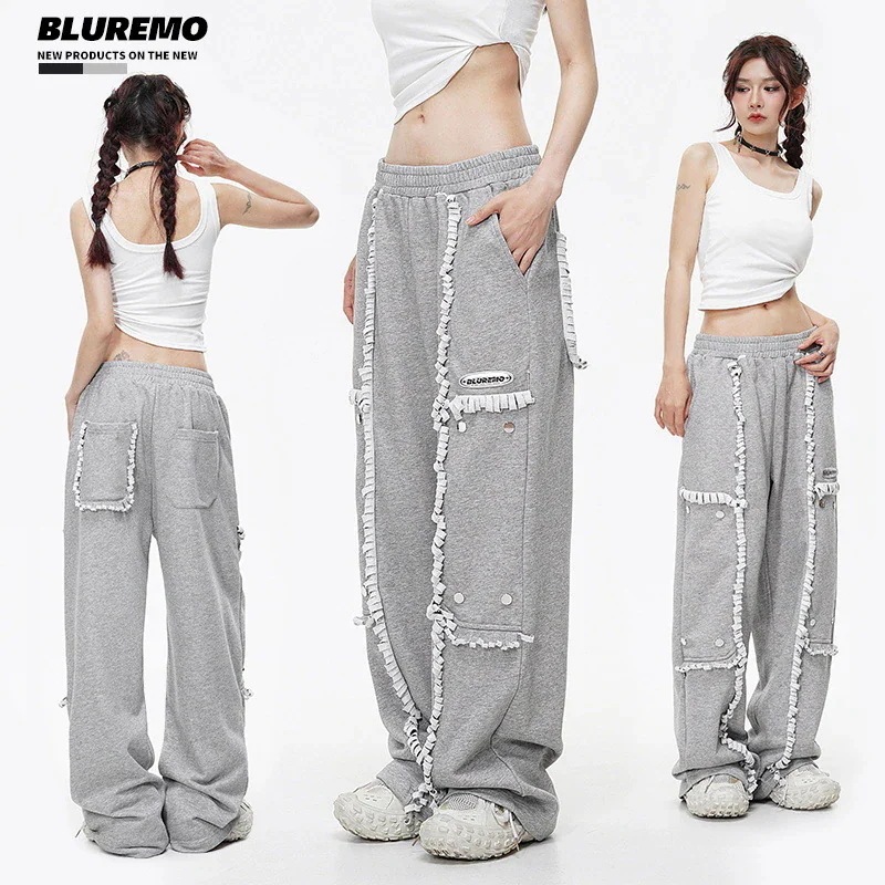 夏のデザインの破れ継ぎ目カット破れ飛辺金属四合ボタンワイドストレートパンツ