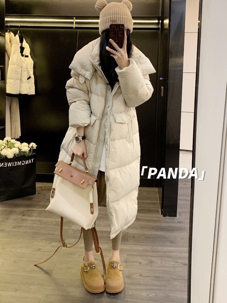 欧品は甘美なダウンジャケットを厚くして女性の反季冬2023の新型のロングタイプの高級感がとてもきれいで帽子のコートもきれいです