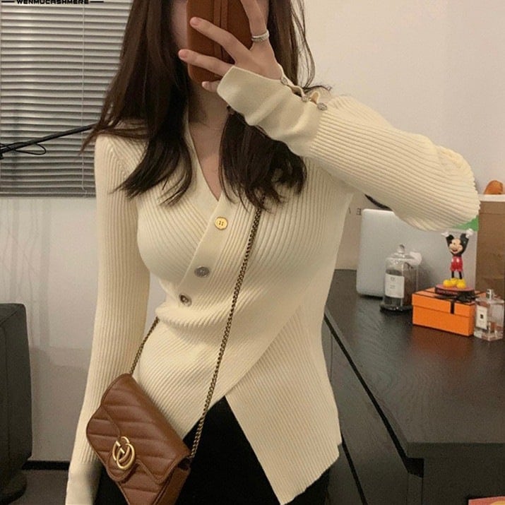 不規則なデザインの斜めボタンニット女性の秋の新作洋風純色セーターカーディガントップス