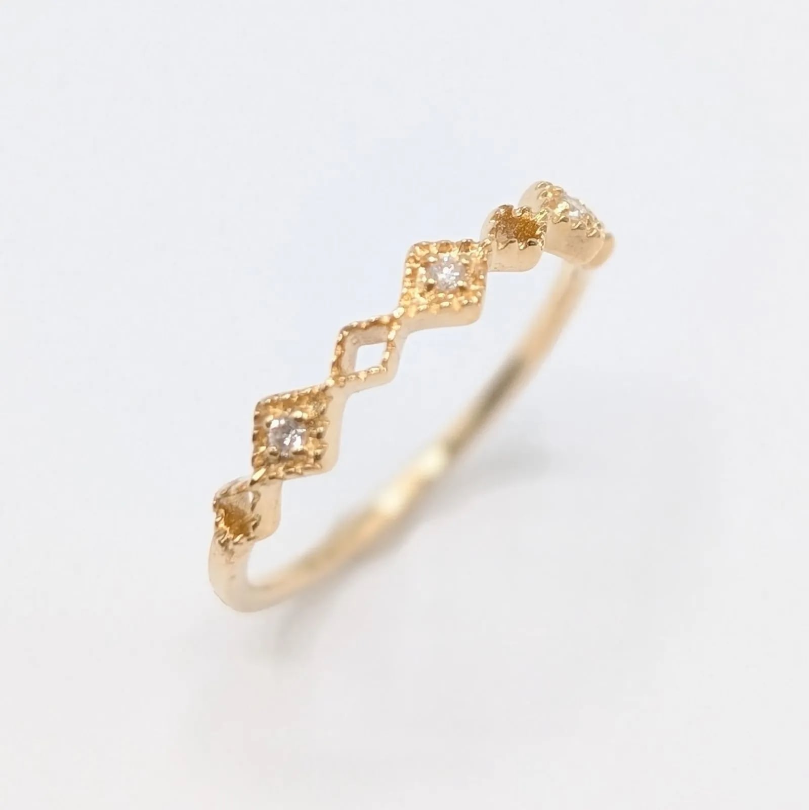 【新品仕上済】ダイヤモンド リング K10YG-0.7g D：0.01ct 7号/47 ミル打ち イエローゴールド