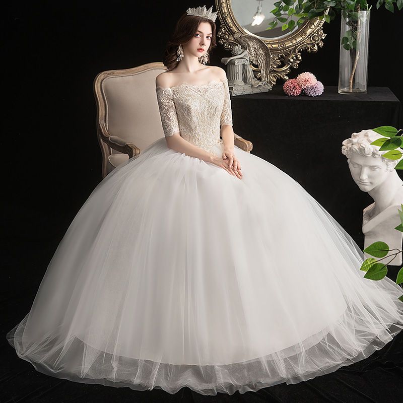 フォレスト風シャンパンカラーメインウェディングドレス2025韓国風シャンパンレースミッドスリーブ着痩せブライダル結び目春夏