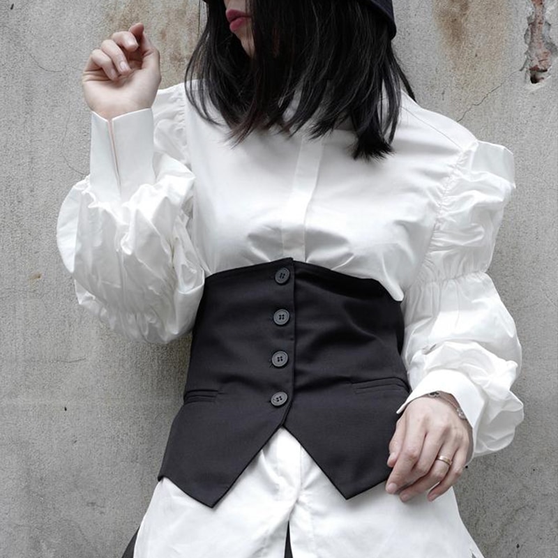 女性の黒いボタンスプリット非対称ルーズベスト新しいノースリーブファッショントレンド多目的な女性のベストパーソナリティデザインファッションノースリーブベスト
