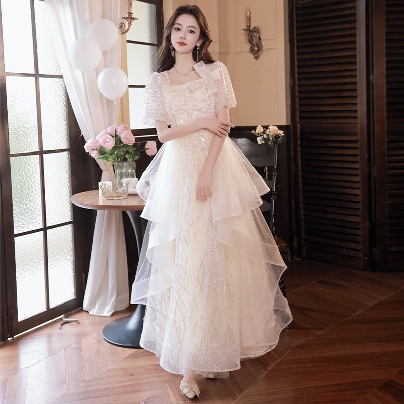 女性のためのシャンパンイブニングドレス2024新しいライト高級ニッチハイエンドハイエンドロングフェアリーガーゼスカート秋