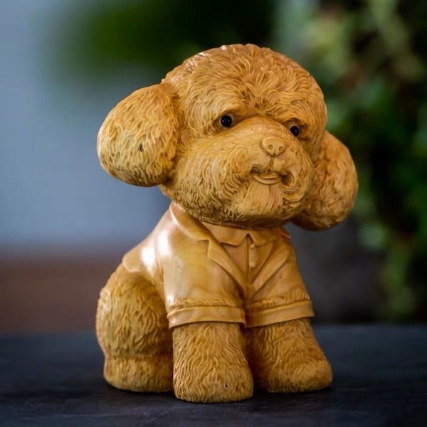 子犬の木彫りの置物 寂しく