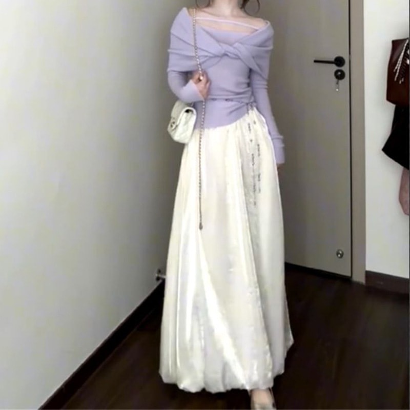 バタフライノットのオフショルダートップスとハイウエストロングスカートの優しくスタイリッシュなデザインが春秋にぴったりなレディースツーピースセットです