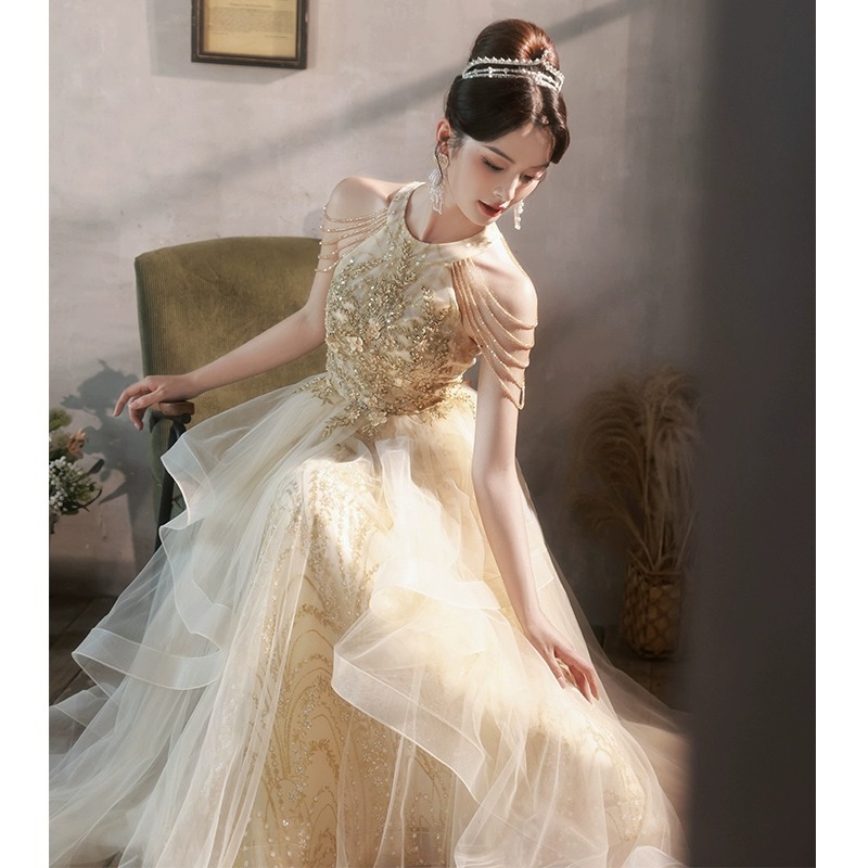 女性用のシャンパンカラーのイブニングドレスエレガントなタッセルデザイン洗練された豪華なニッチな高級パフォーマンスドレス