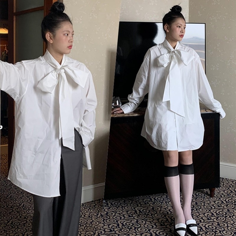 トップス シャツ ブラウス 白シャツ ミディアム丈 半端丈 長袖 ドロップショルダー ボウタイ ストレート ワイド Aライン リボン 前開き ボタン かわいい 大人可愛い きれいめ シンプル