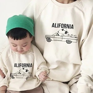親子服トップス，幼稚園ユニフォーム，子供服春秋新作韓国版ワイルドルーズプリントセーターTシャツ トップス