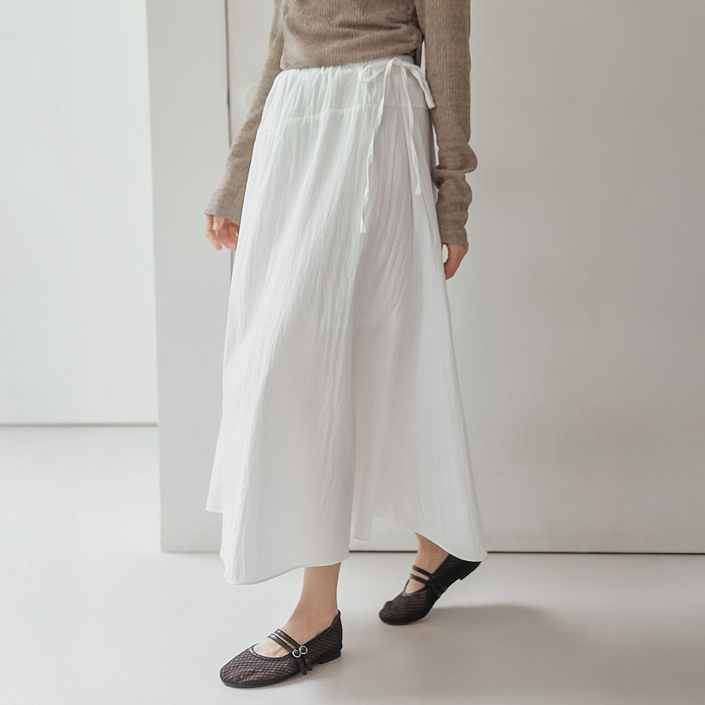 コエリンナイロンバンディングオブリックラインフレアロングスカート