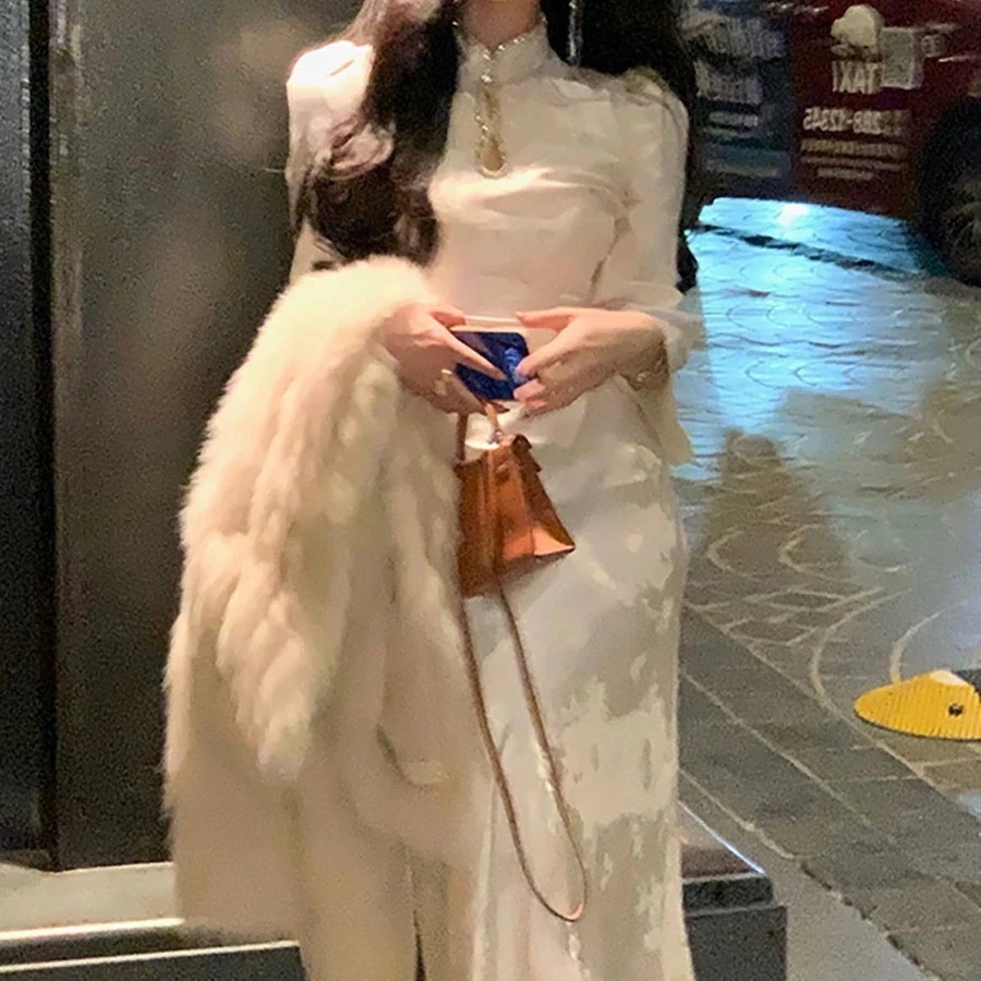 豊かな美学り穴あけ新風チャイナドレス女性の光沢のあるフィッシュテールロングスカート2026初春ドレス