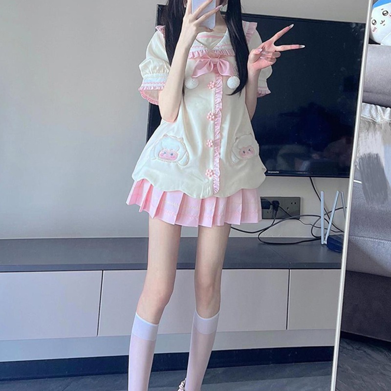 カラーブロックのゆったりカーディガントップスとプリーツスカートが特徴的な日本風の可愛くて若々しいレディースツーピースセット