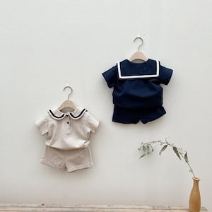 夏の新しい男性と女性の赤ちゃん半袖ネイビーカラースーツ3-6-9ヶ月幼児トップ+パンツ