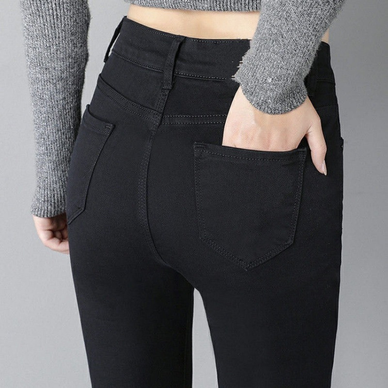 秋と冬の女性用の黒のハイウエスト ジーンズベルベットと厚みのある新しいタイトフィット伸縮性レッグ パンツ