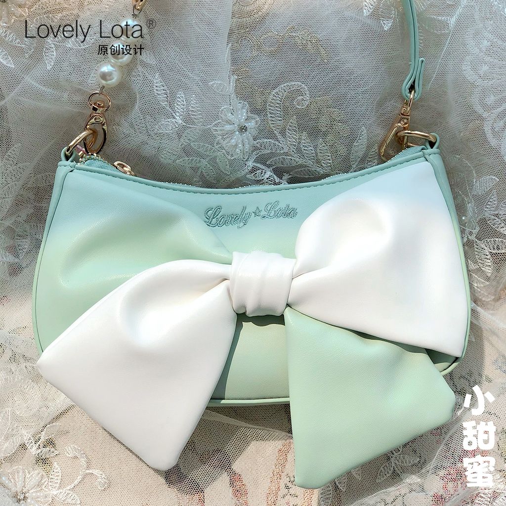 LovelyLotaオリジナルの小さな甘い蝶結び餃子バッグの軽いショルダーバッグはシングル肩の在庫一掃特価です