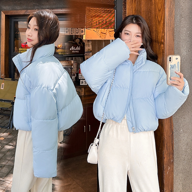 ヨーロッパとアメリカのスタイルのハイウエストのダウンコットンコートふわふわの婦人服新しいファッションスタンドアップカラージッパーポケット女性用の伸縮性のある裾のコットンコート