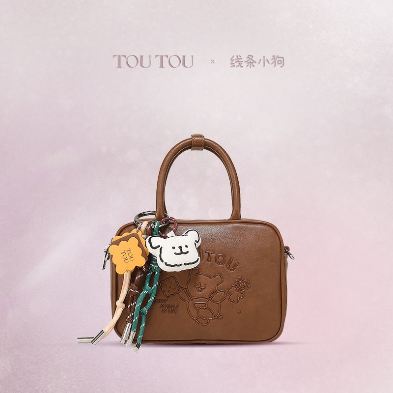 TOUTOUの透き通ったラインの子犬のカバンの女性の肩の斜めのショルダーのカバンは彼女にプレゼントします 7,860円
