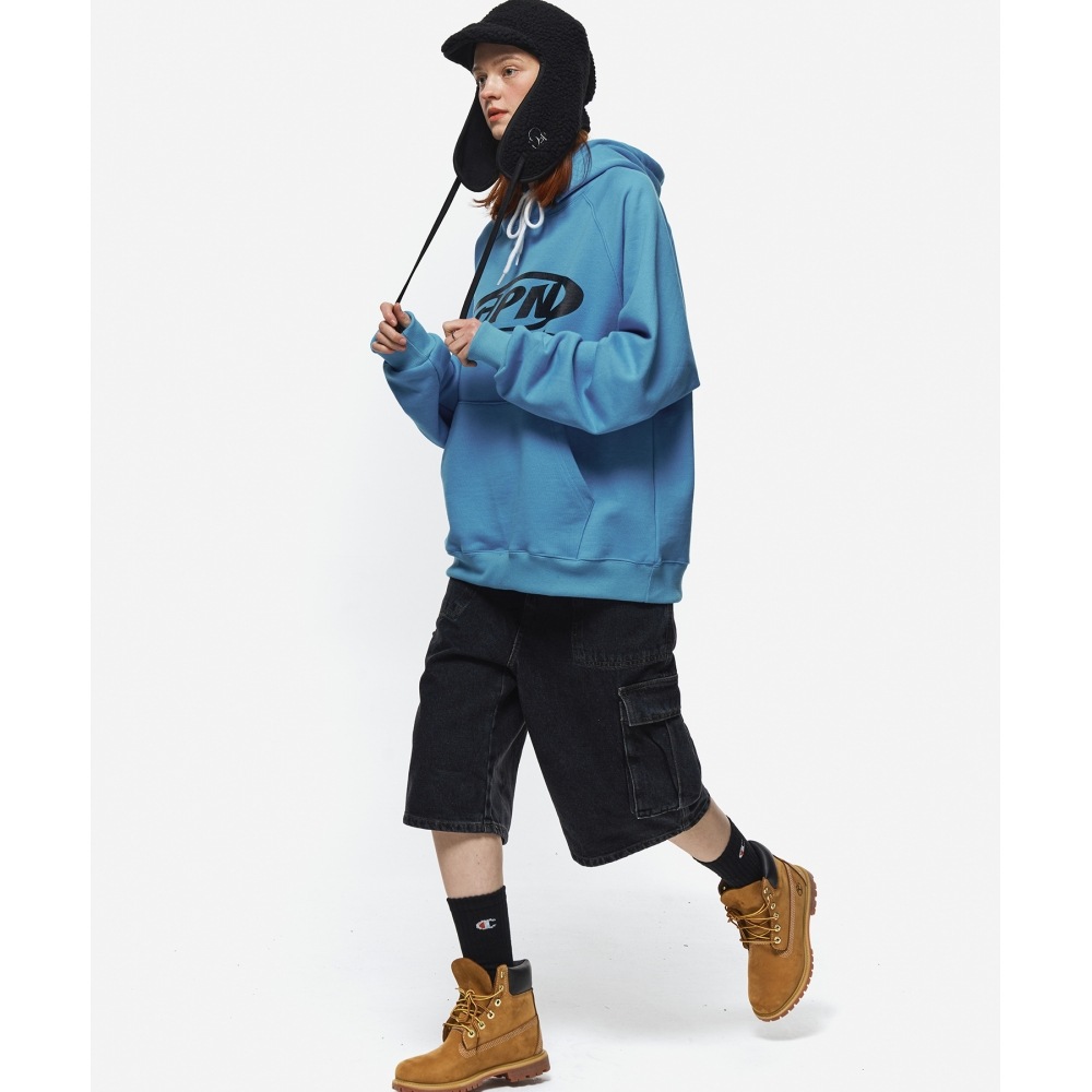 CPGN スタジオオーバル C ロゴラグランパーカーブルー