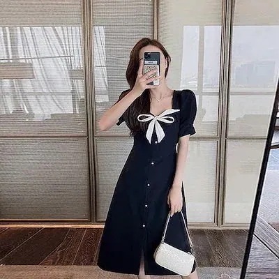 ニッチヘップバーンスタイルのドレスの女性のレトロロングスカート