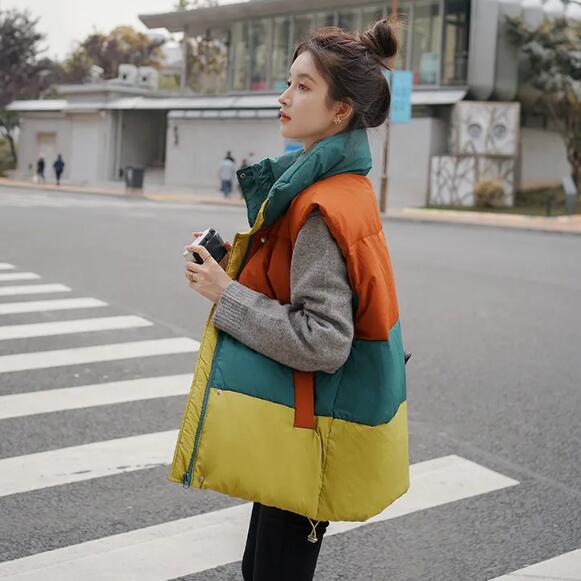 新型小柄な韓国版ゆったりとした衝突色を厚くした上にベストを着た女性