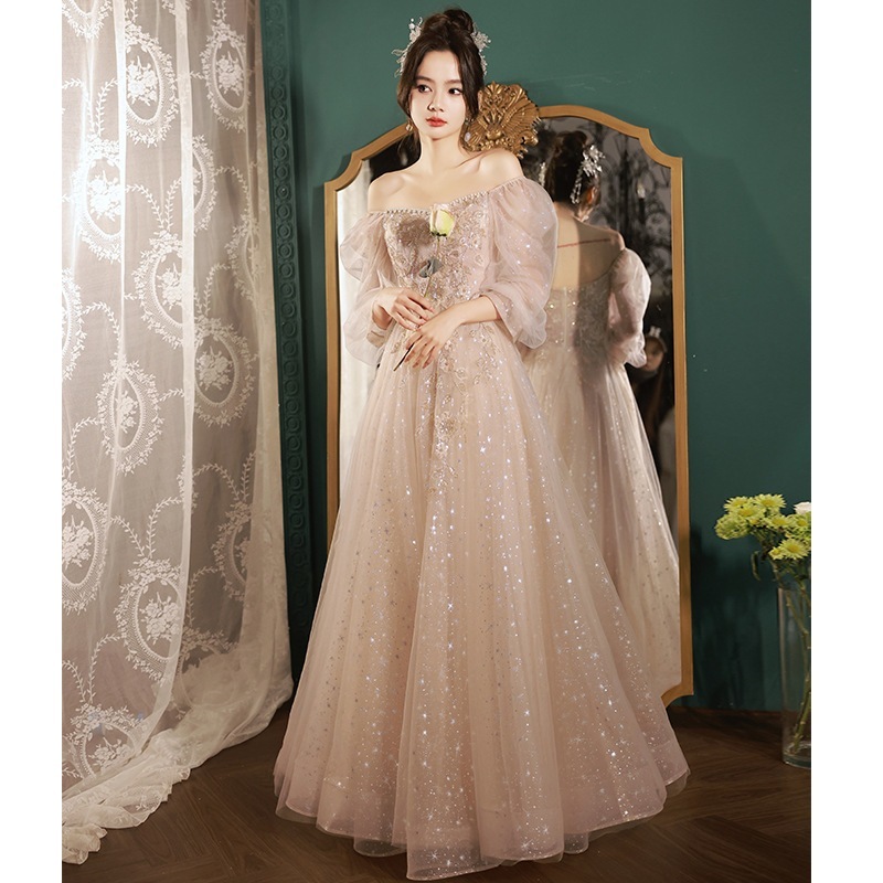 シャンパンイブニングドレス 2024 新しい宴会気質ワンショルダー花嫁介添人ドレスニッチ高級ハイエンドホスト