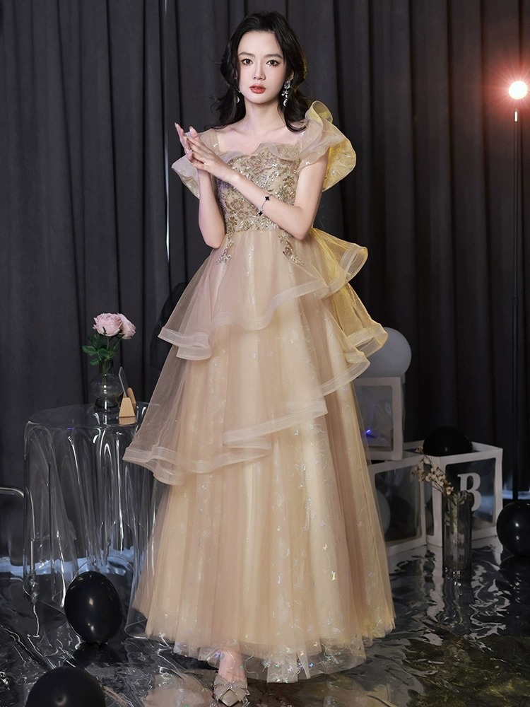シャンパンカラーホストイブニングドレス女性ニッチライトラグジュアリーハイエンドスーパーフェアリーエンゲージメントドレスアートテストベルカントハイエンドセンス