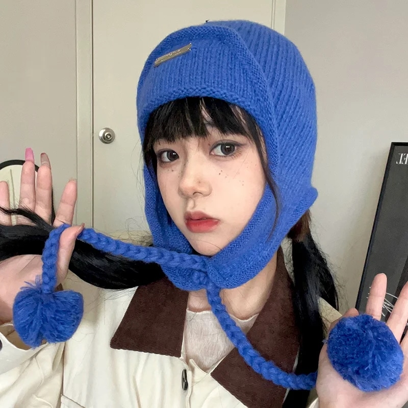 韓国の指輪のファッショナブルなボンバーハット秋冬厚くされた耳の保護暖かいニットのフライトキャップ男性青のpom-pom女性の帽子