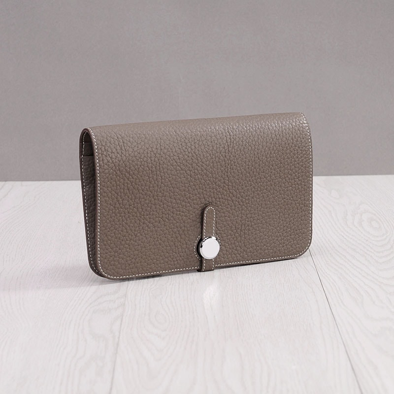 財布の新モデルの女性の長款の本革のファッションの大容量の欧米の大容量のカードの位の頭の層の牛革の銭入れ女性の手はかばんを持ちます